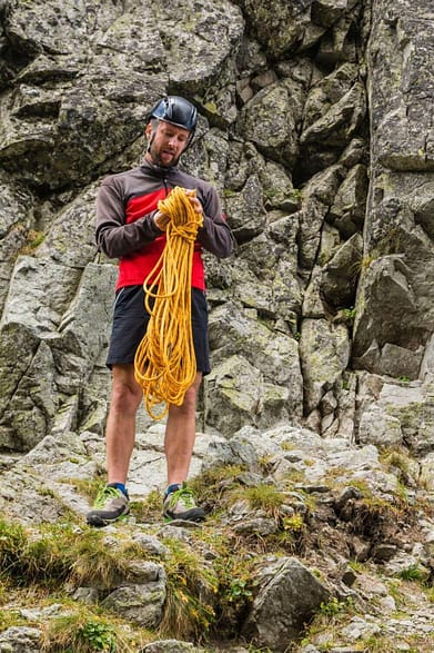 Climber Coiling a Climbing Rope